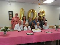 Avalon – David Tilson, M.P. celebrating the 102nd birthday of Mildred Wichmann (right) & Jospehine Uskoski (left) with family and staff at the Avalon Care Centre